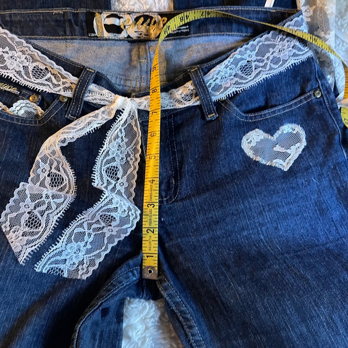 ୨୧ reworked y2k princess OOAK white ribbon flare jeans with contrast stitching, heart patch, lace panels + bows