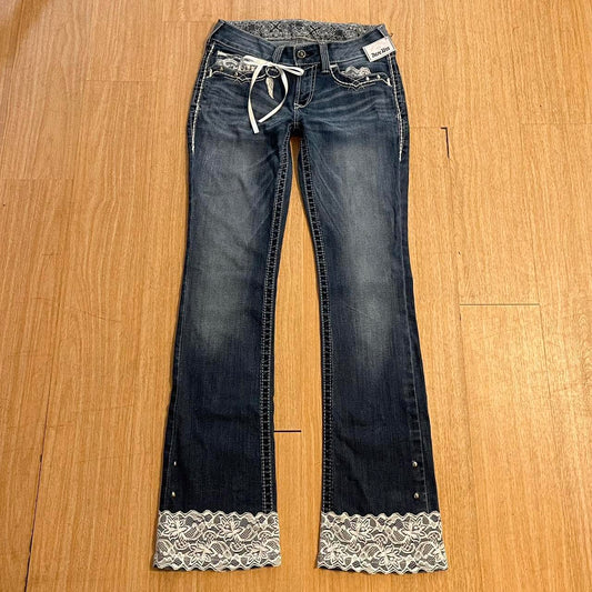 ୨୧ reworked y2k angel princess ooak white ribbon flare ariat jeans with thick contrast stitching, angel wing charm, studs, lace cuffs, lace trim & bows