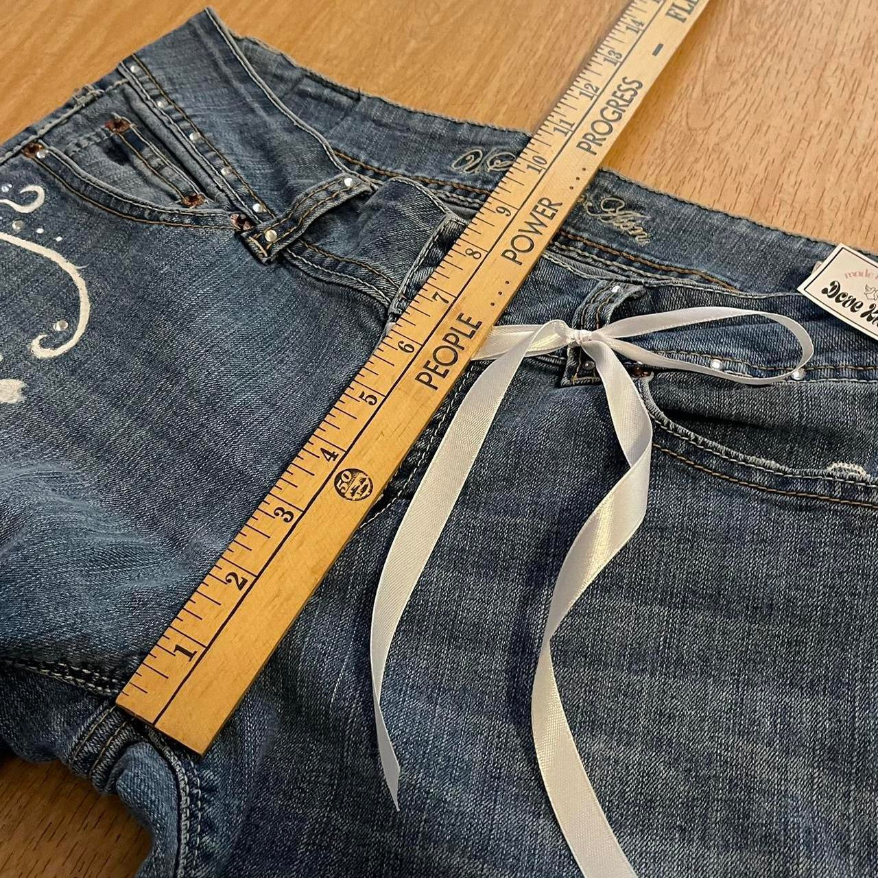 ୨୧ reworked y2k “Valia” by Dove Kiss OOAK white ribbon flare jeans