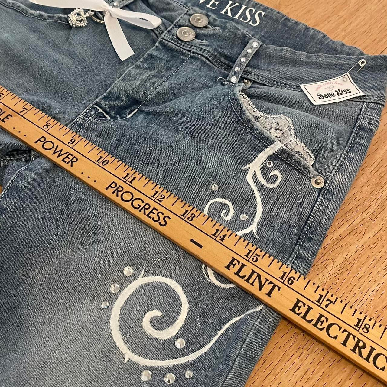 ୨୧ “𝑽𝒂𝒍𝒊𝒂” by Dove Kiss 2000s OOAK white ribbon flare jeans