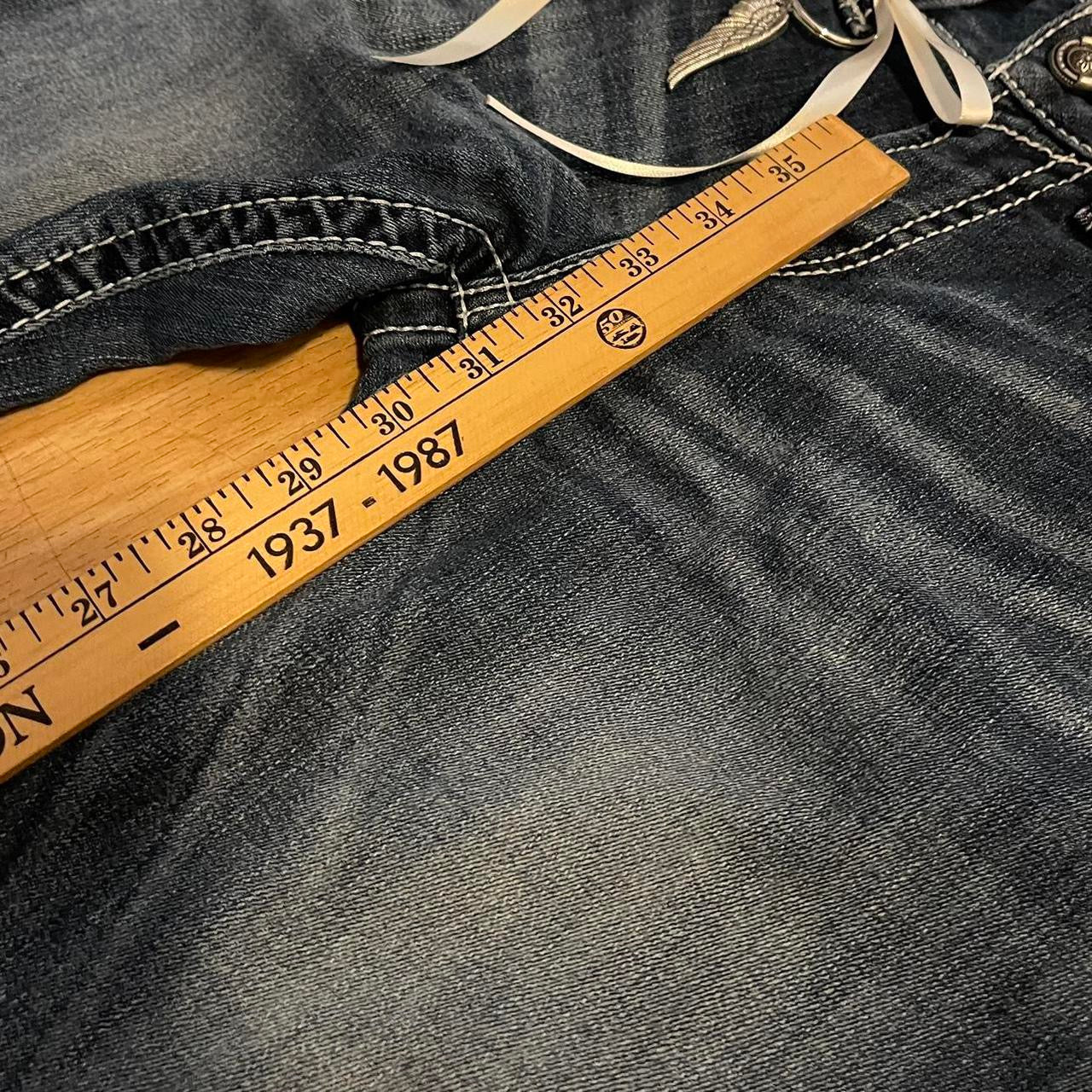 ୨୧ reworked y2k angel princess ooak white ribbon flare ariat jeans with thick contrast stitching, angel wing charm, studs, lace cuffs, lace trim & bows