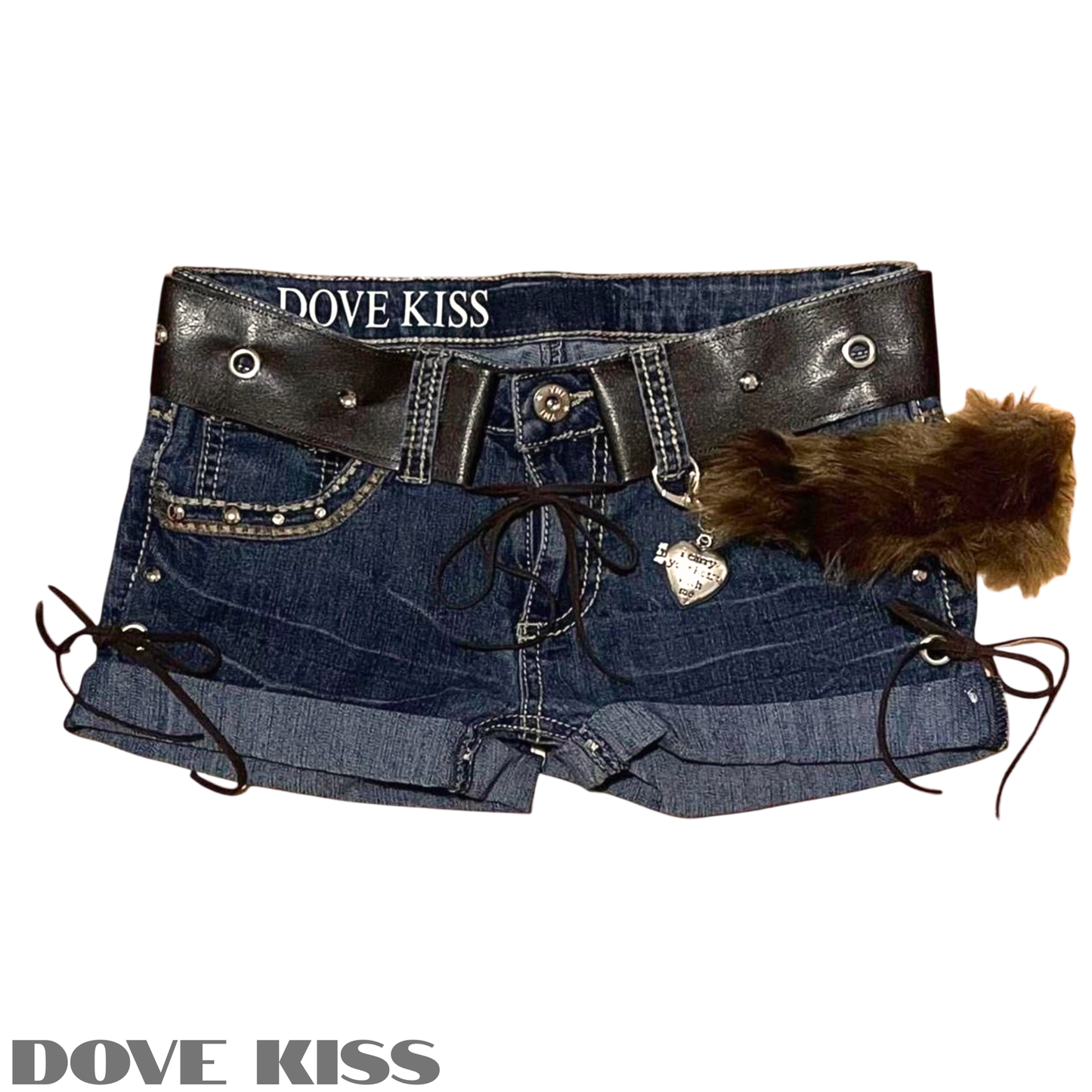 A pair of blue denim shorts featuring a wide black faux-leather belt with silver studs, lace-up side details, a dangling silver heart charm, and a brown faux-fur accent, shown on a white background with DOVE KISS branding.