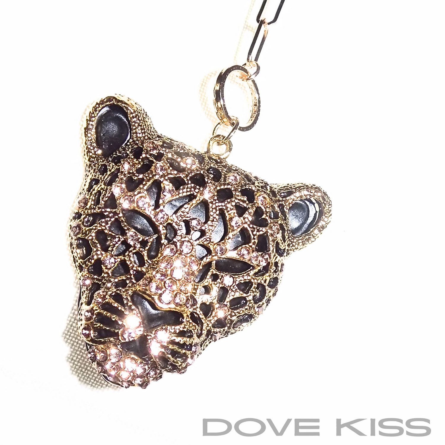 A gold-toned leopard head pendant necklace embellished with dark and light rhinestones, hanging from a gold link chain against a white background with a 'DOVE KISS' brand watermark at the bottom.