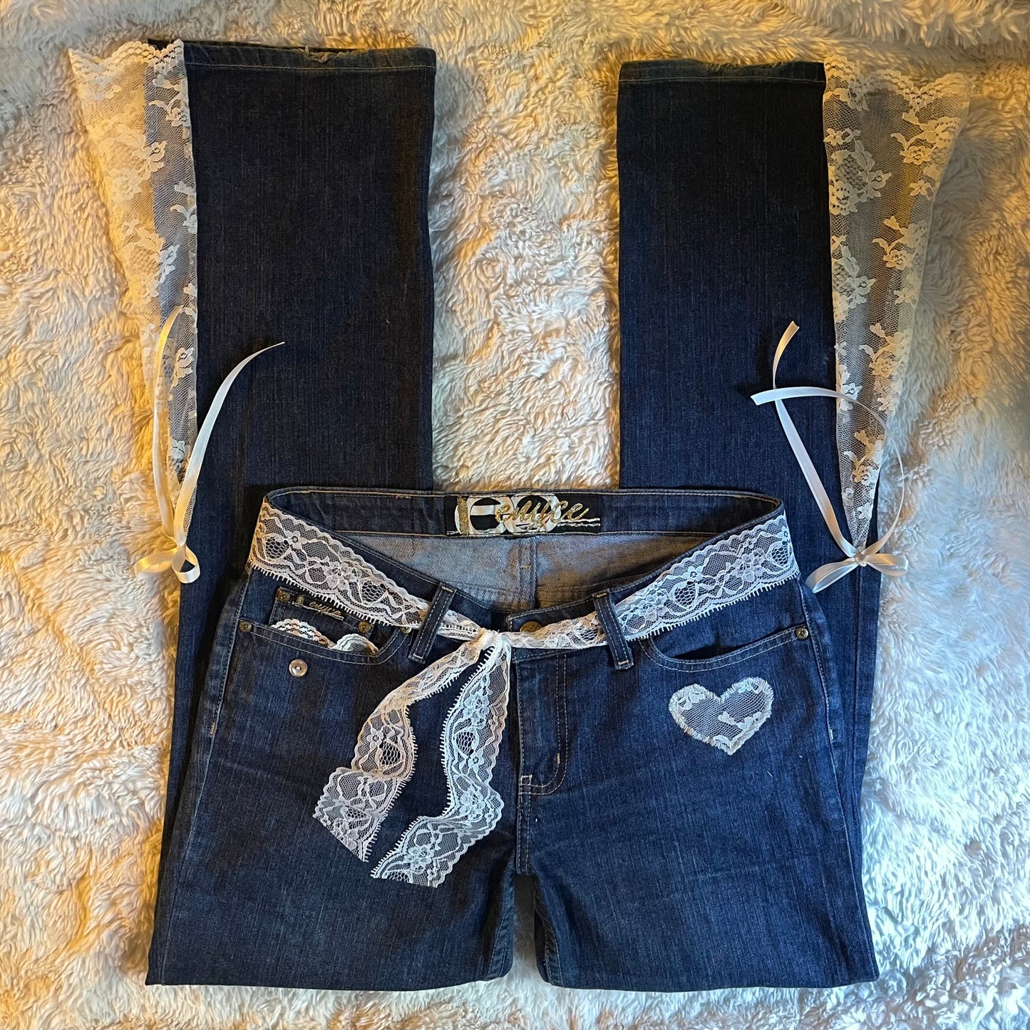 ୨୧ reworked y2k princess OOAK white ribbon flare jeans with contrast stitching, heart patch, lace panels + bows